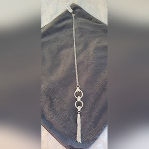 New, never worn, long, brilliant silver double ring tassel necklace.